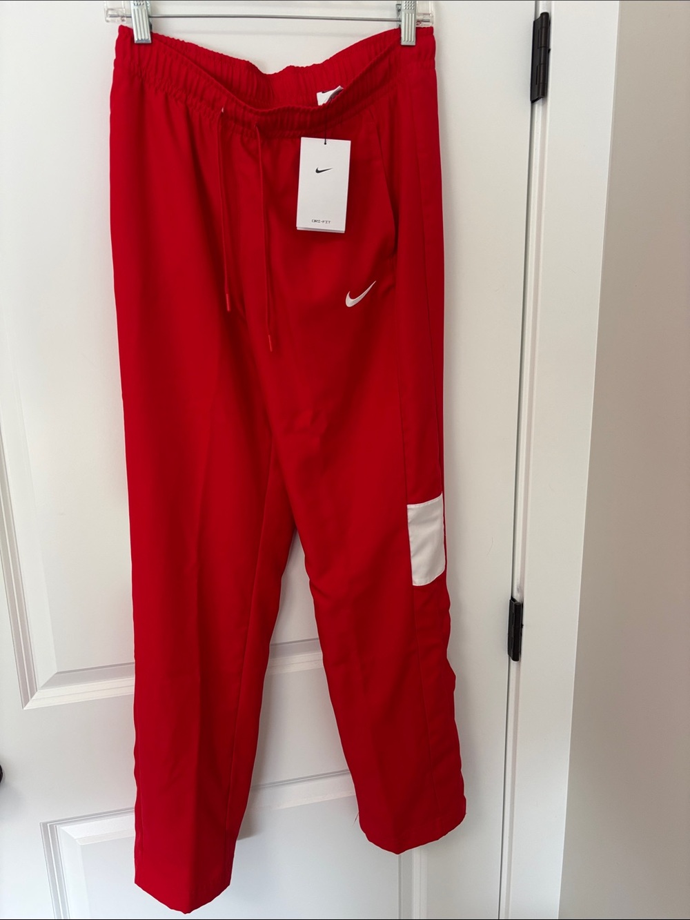 Nike Women’s Red Jogger Pants with White Patch. Size Medium.